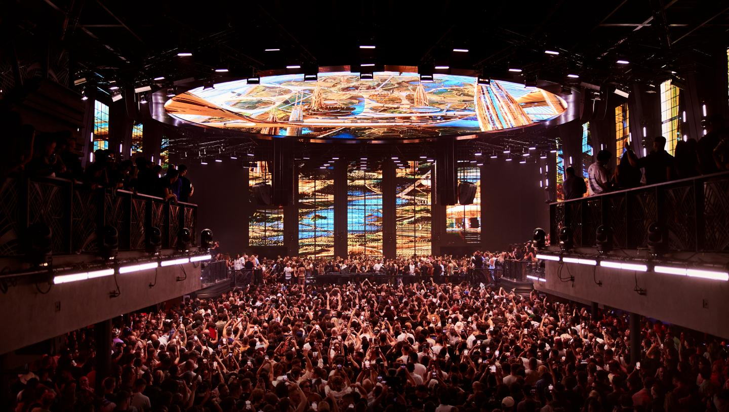 UNVRS dance floor packed beneath a spectacular illuminated ceiling